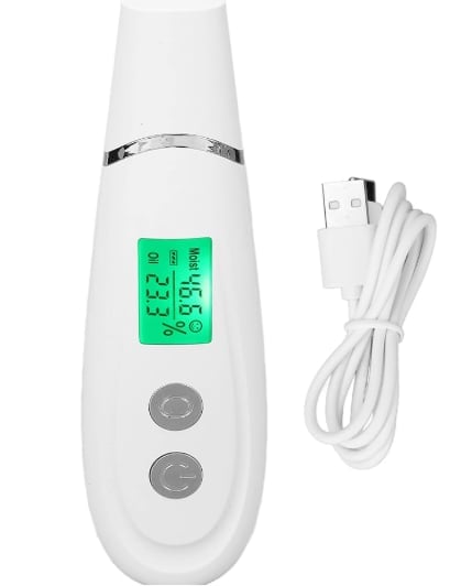 White handheld facial skin analyzer device with green digital display, control buttons, and USB charging cable